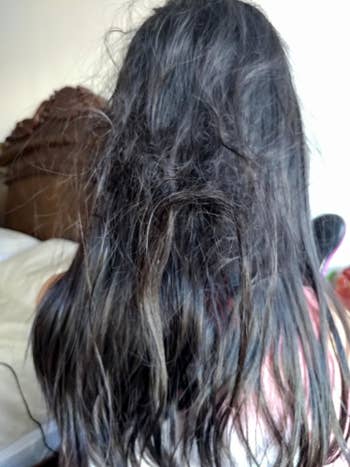 Reviewer's before photo showing large tangles in long, straight hair