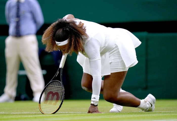Serena Williams falls to the ground during first round match at Wimbledon
