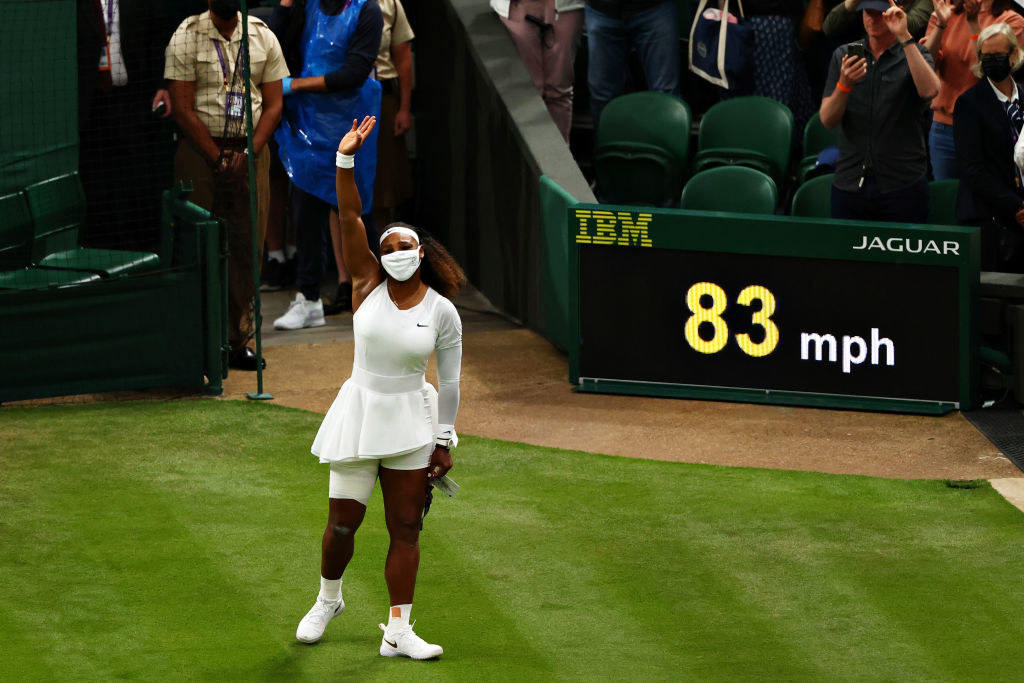 Serena Williams waves goodbye to the crowd after retiring due to injury