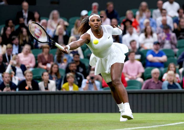 Serena Williams lunges for a ball while playing her first-round match at Wimbledon