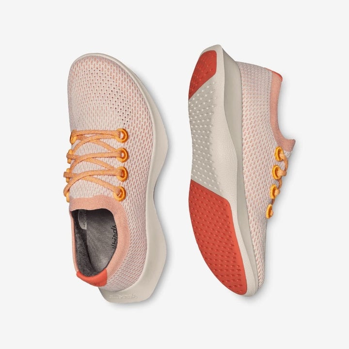 a close up of the light weight orange sneakers