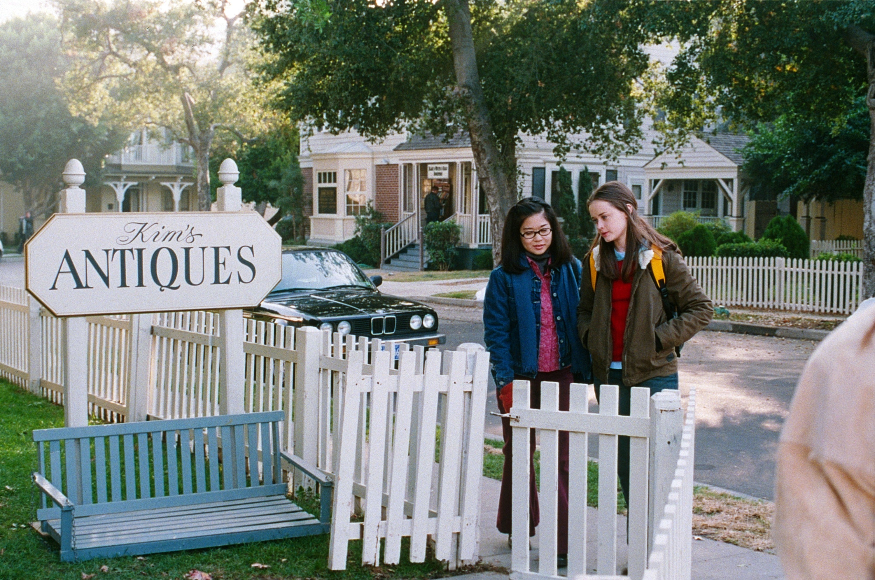 Keiko Agena and Alexis Bledel walk to Kims Antiques on set of &quot;Gilmore Girls&quot;