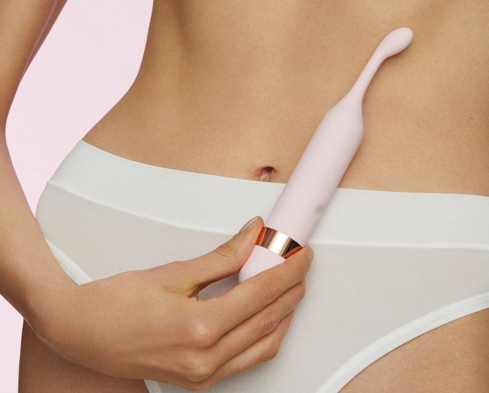 a model presses the quip against their bare torso