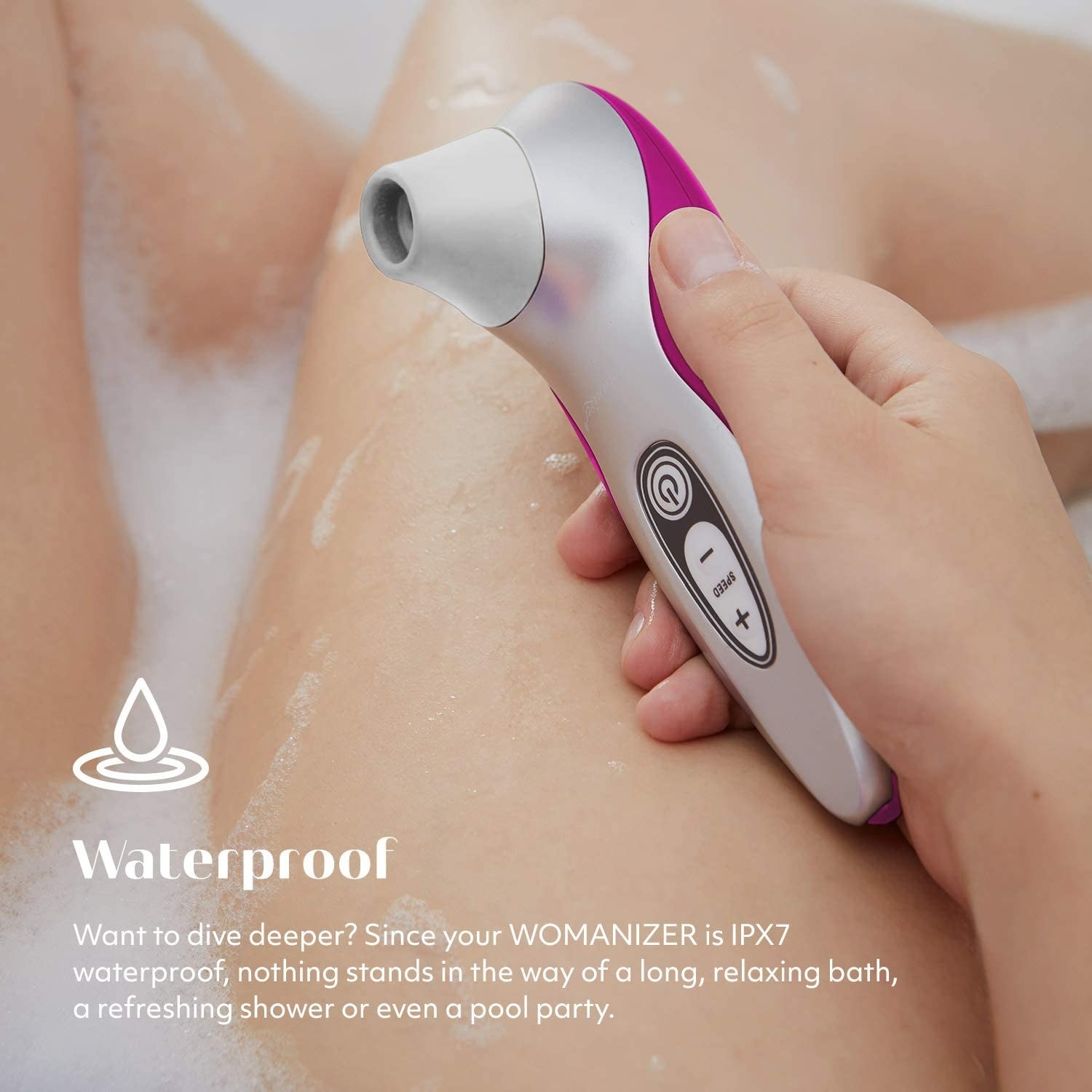 Model holding hot pink and silver vibrator in bath