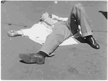 A man lying on the ground and disappearing