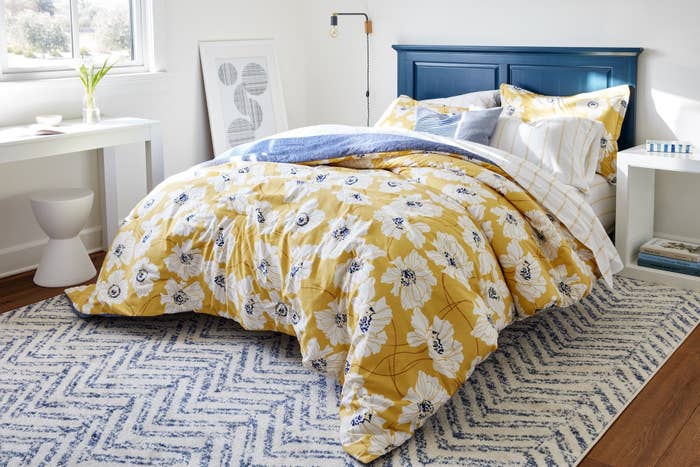 floral bedspread on a bed