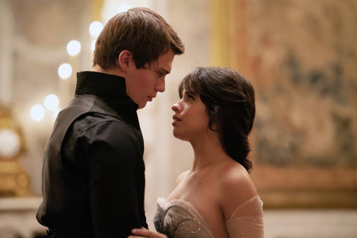 Nicholas Galitzine and Camila Cabello look at one another on set of Amazon's "Cinderella"