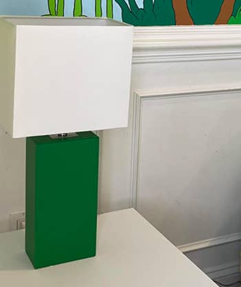 The customer review photo of the leather table lamp in green