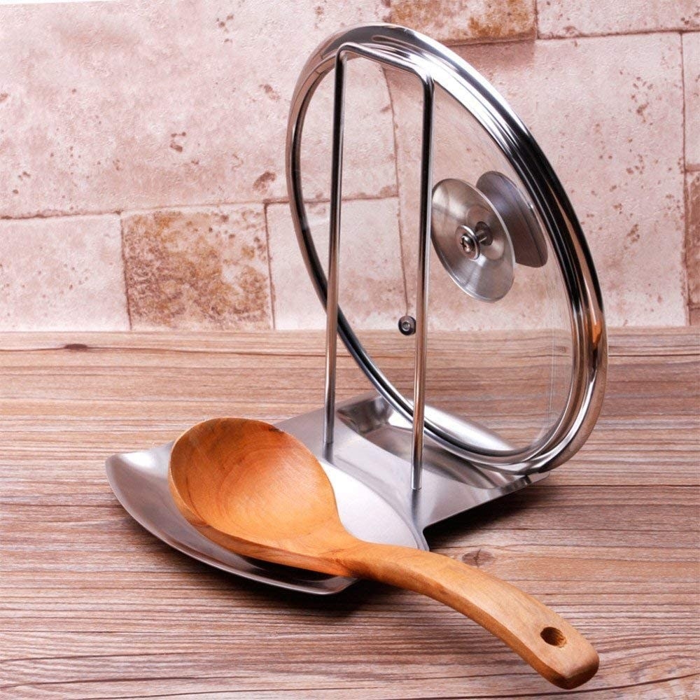 a stainless steel combo spoon rest and pot lid holder
