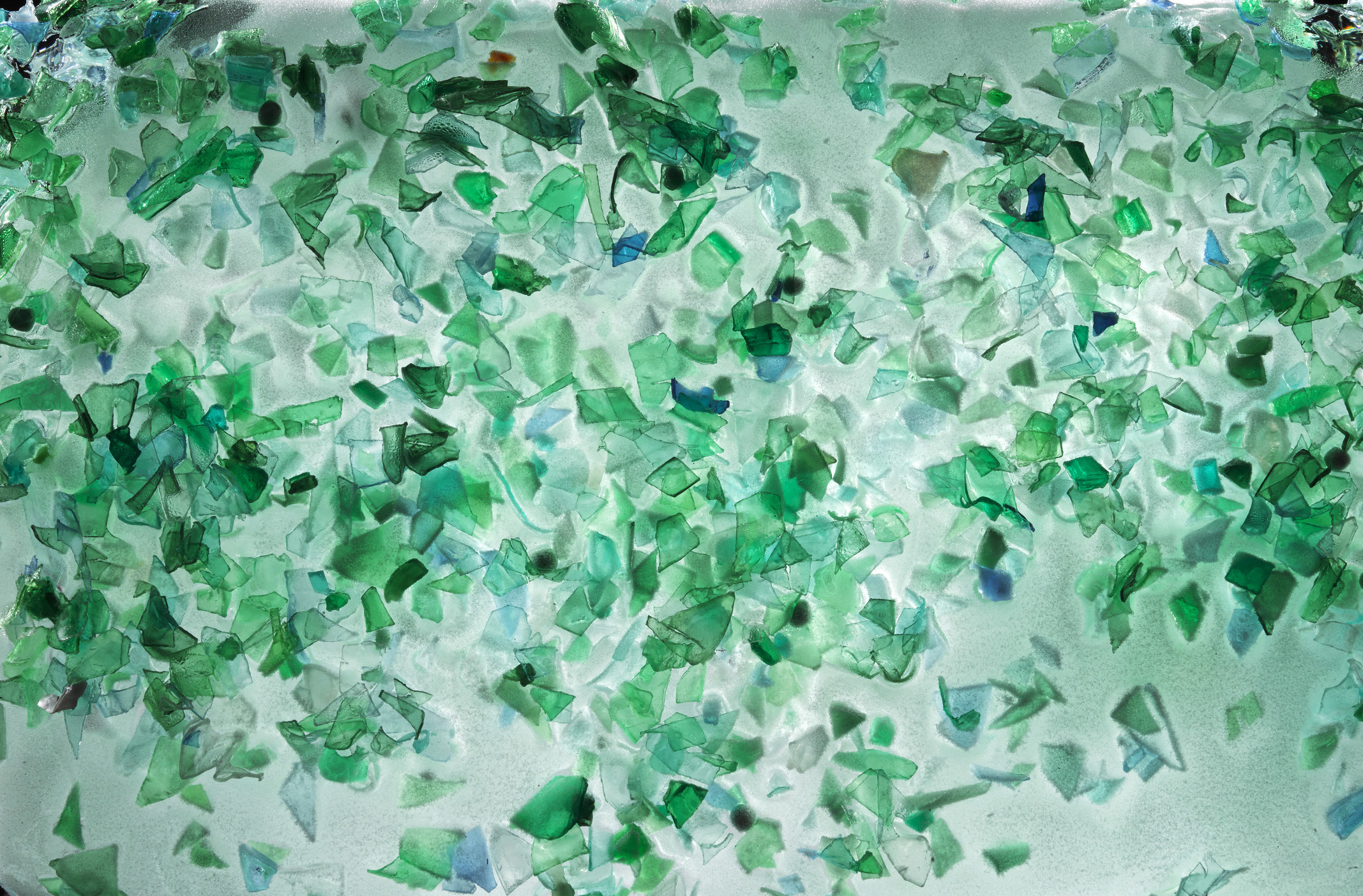 Small pieces of plastic from green bottles fished from the ocean