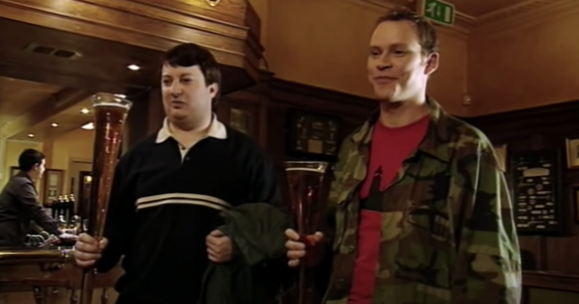 men holding large glasses of beer