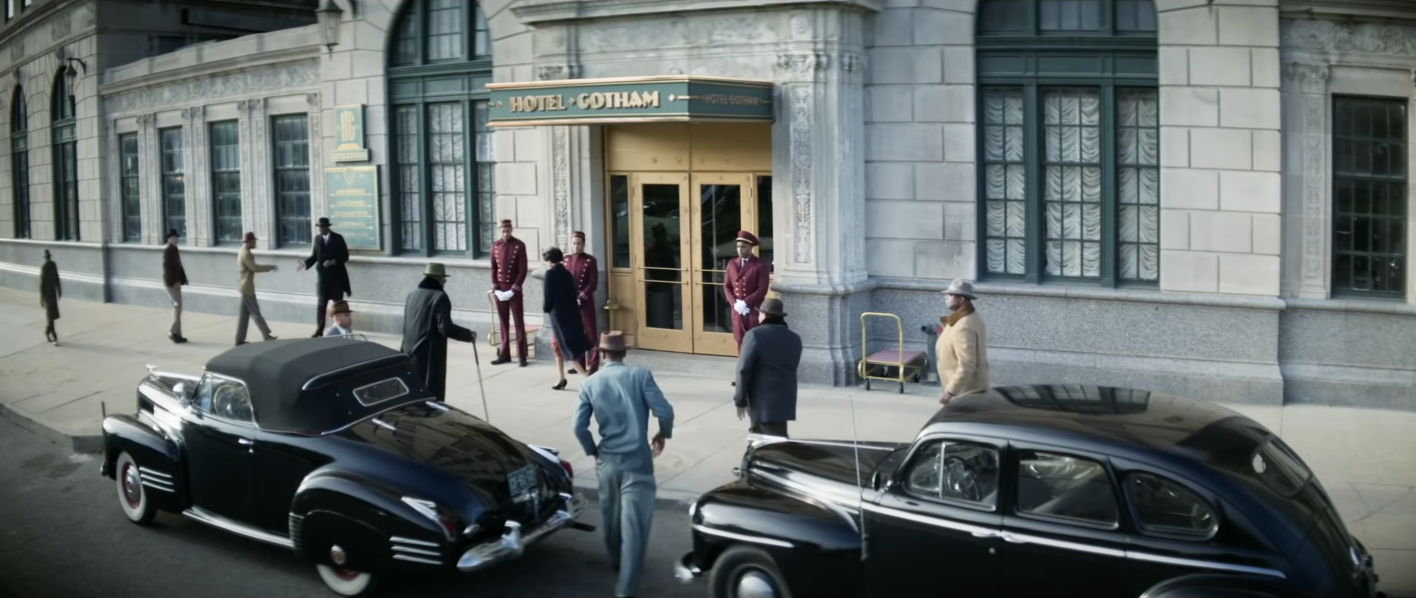 cast of &quot;No Sudden Move&quot; getting out of a car and getting ready to go into hotel gotham