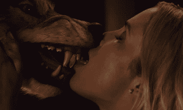 the character kissing the wolf head