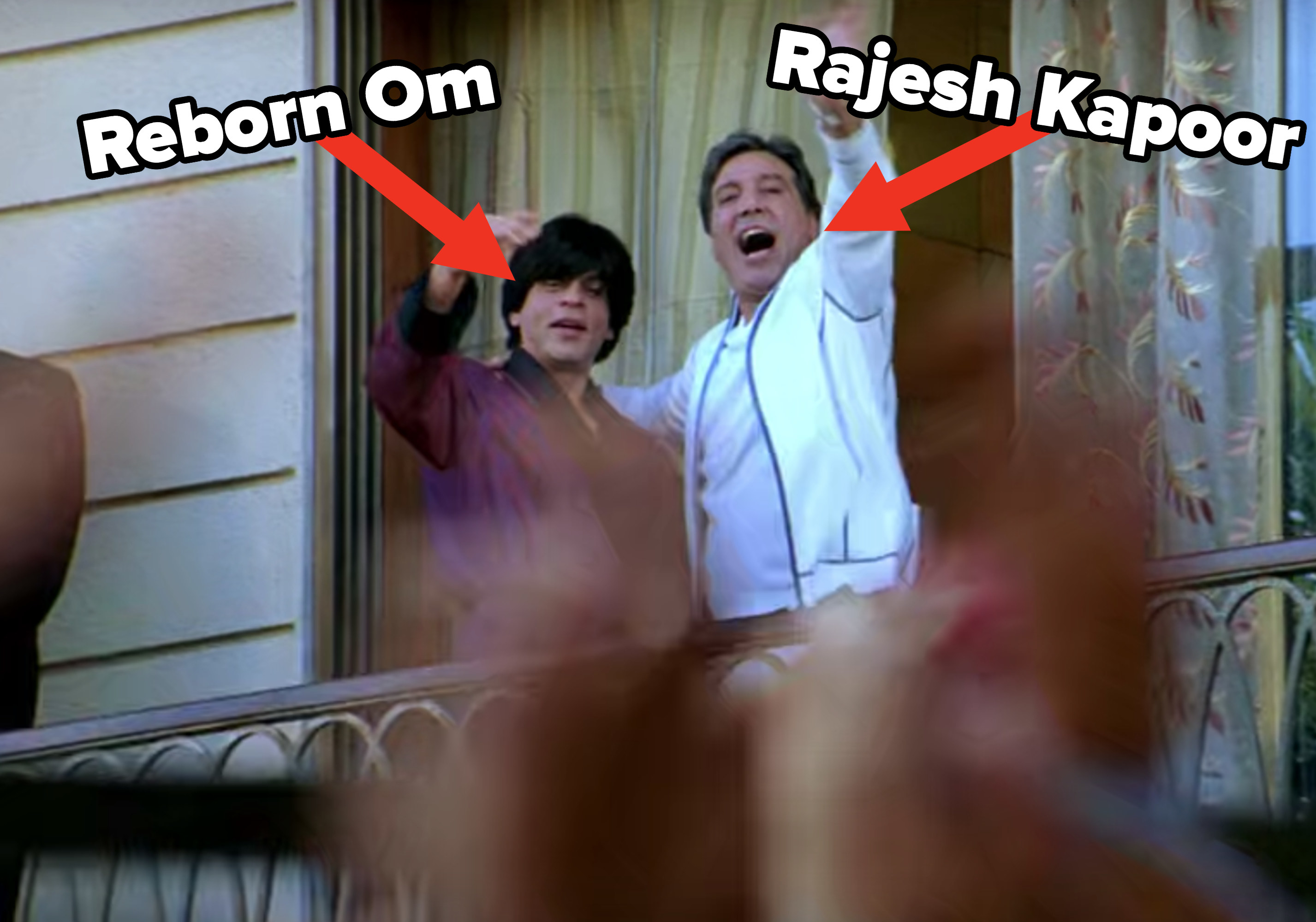 A reborn Om stands next to his new father as they wave to a crowd of fans from a balcony.