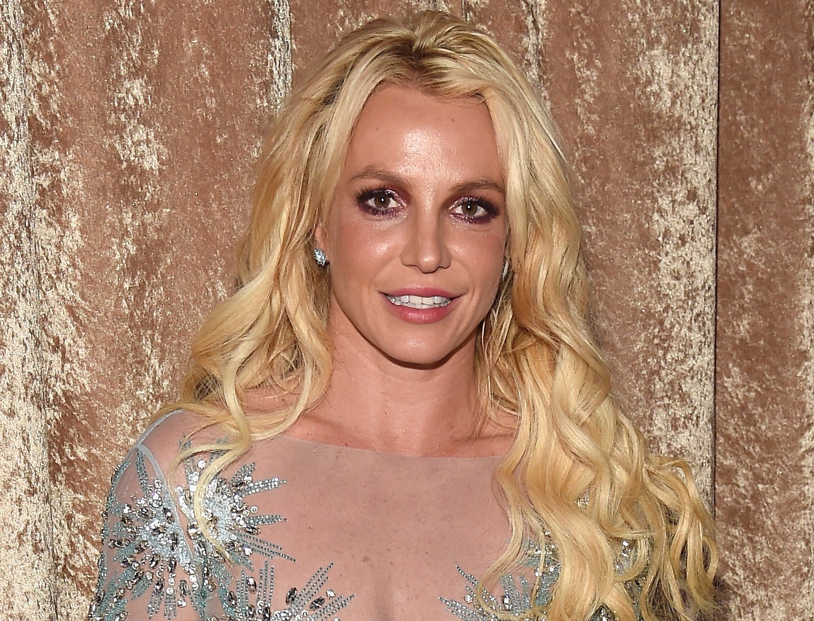 Britney smiles while attending an event