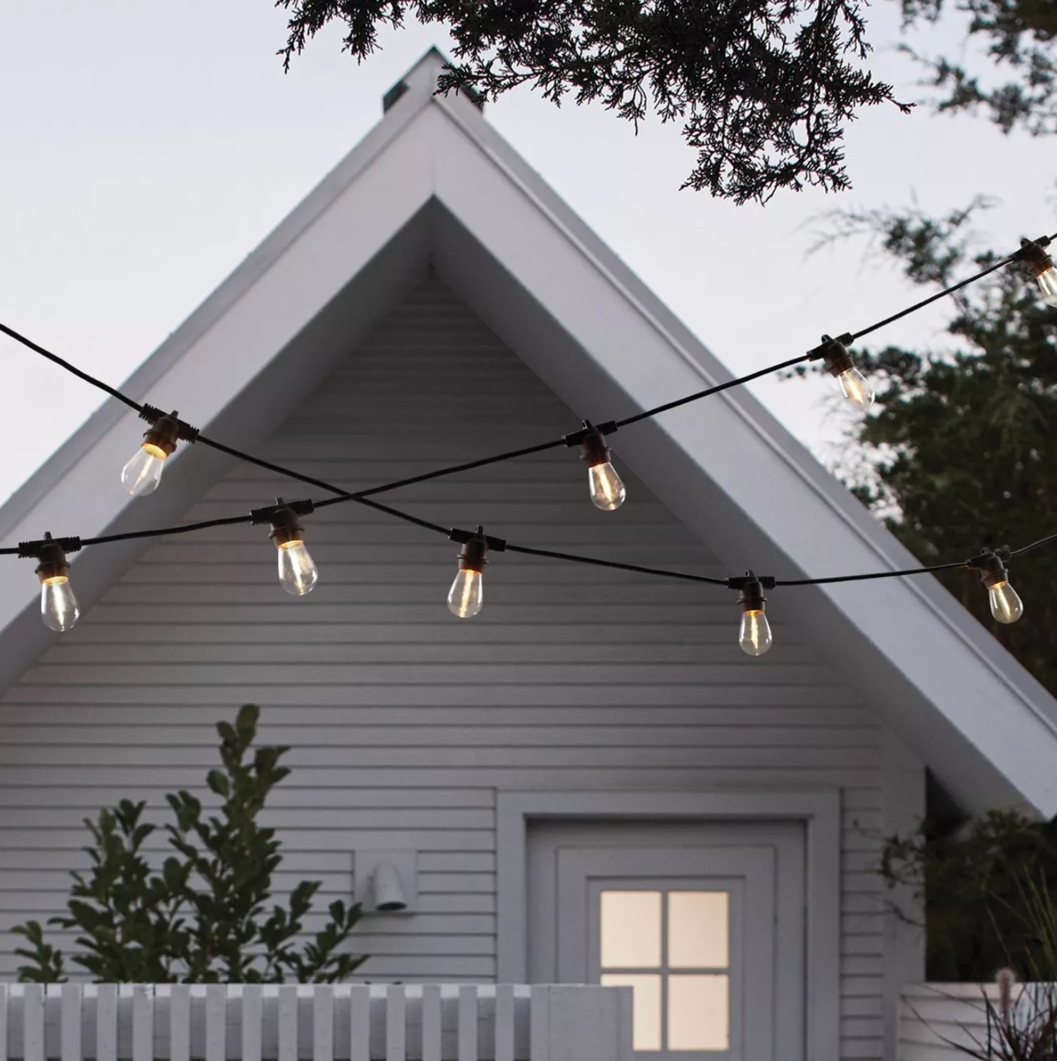 the string lights hung in front of a house