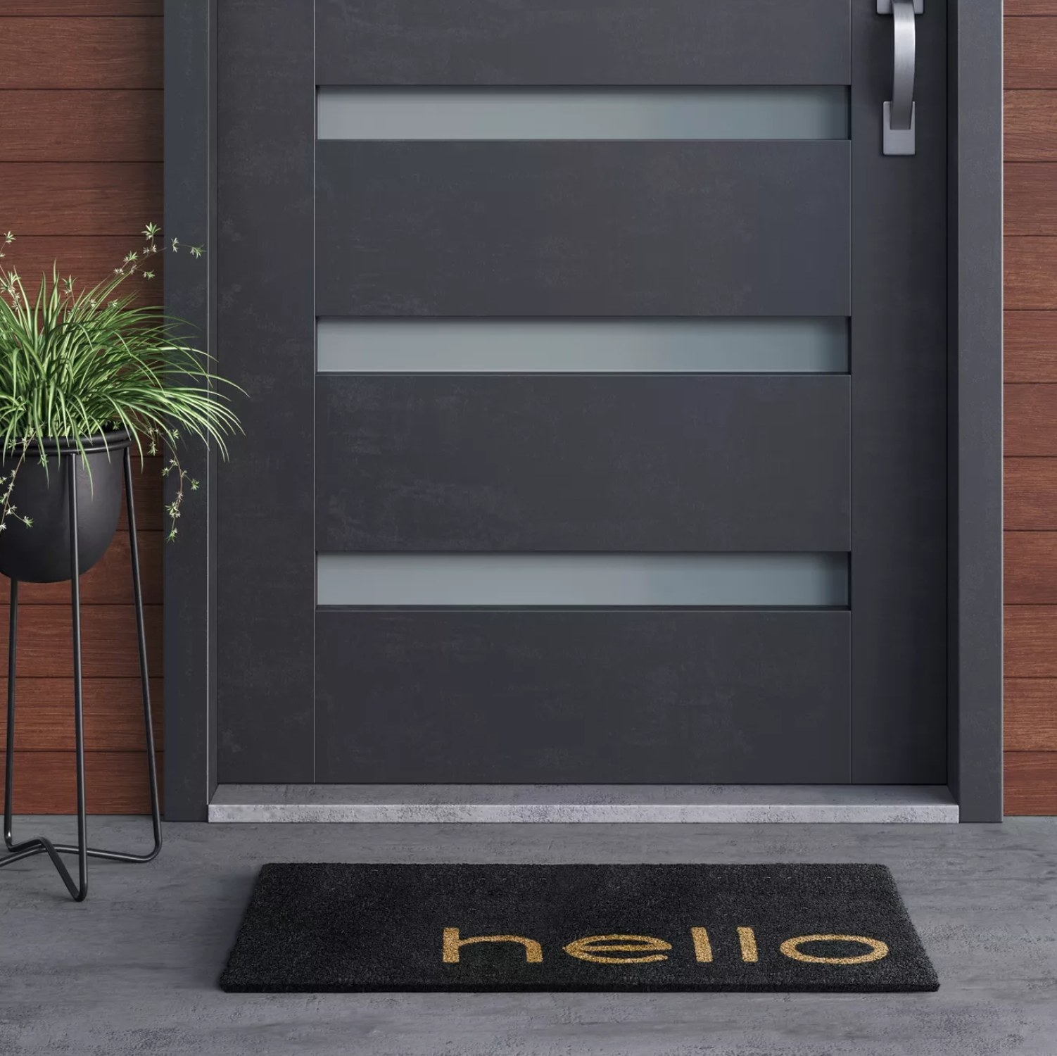the black welcome mat that says "hello" in front of a door