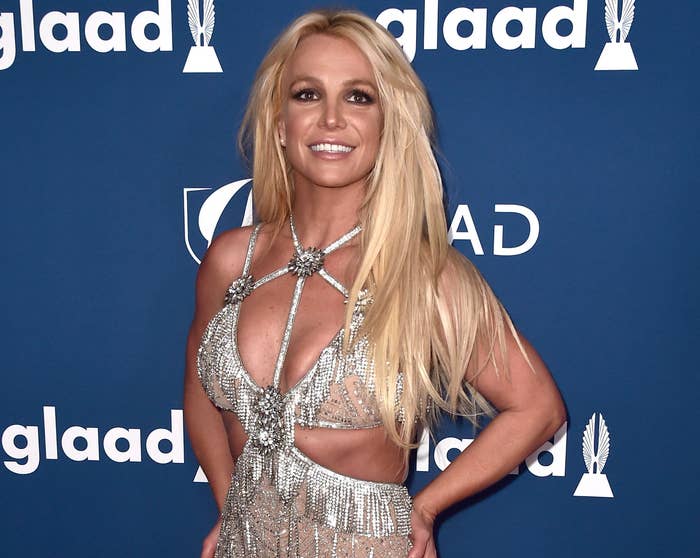 Britney smiles while wearing a diamond encrusted dress