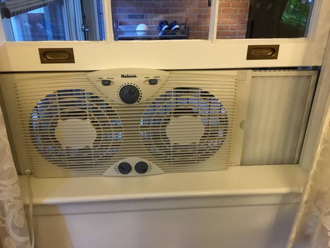Reviewer's window fan placed in window