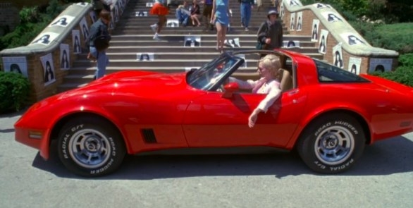 Vylette in Jawbreaker parks in front of the school in a fancy red car