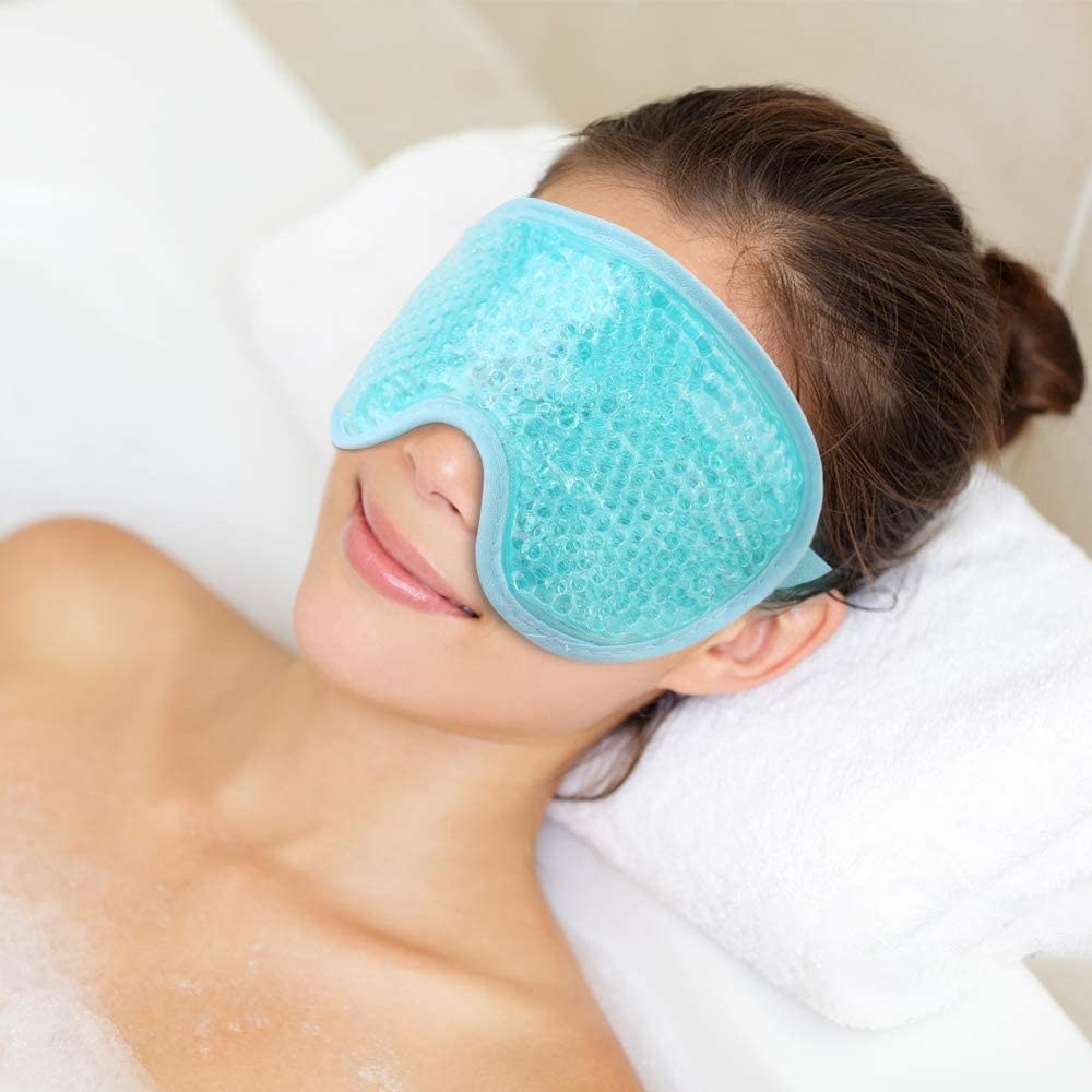 A person wearing a mask in a bubble bath