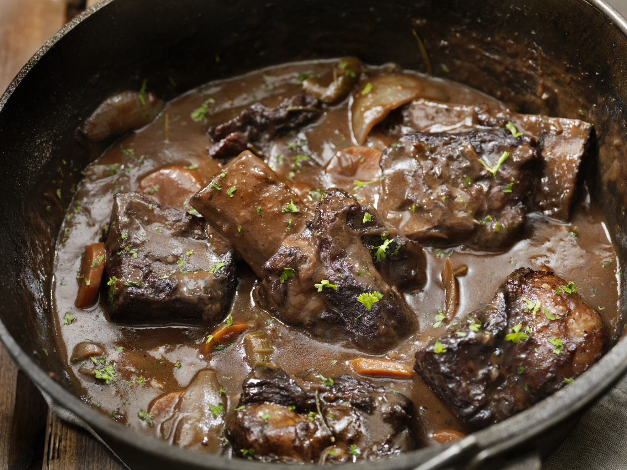 Braised short ribs in a pot.
