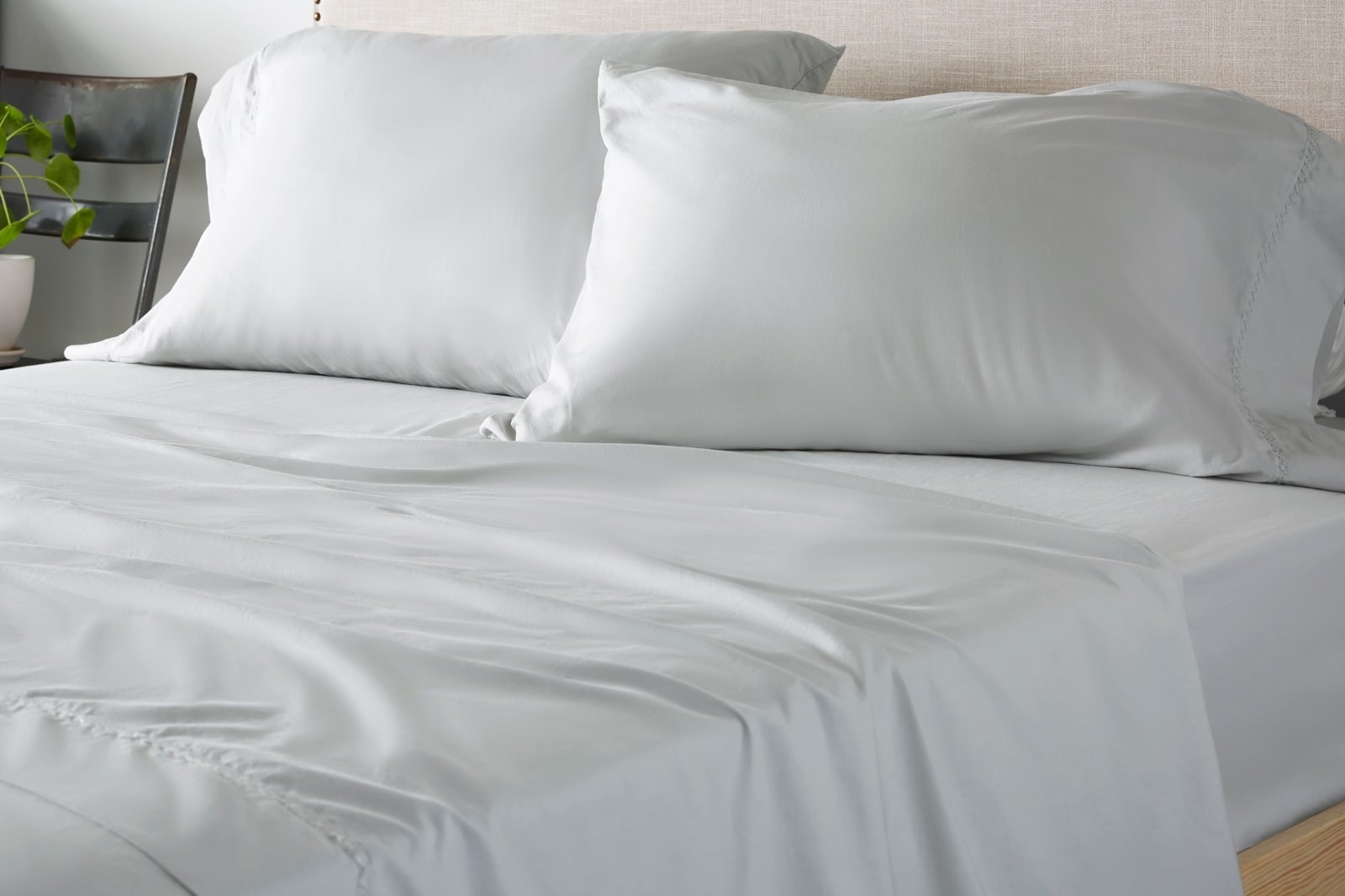 grey satin-like sheets and pillowcases