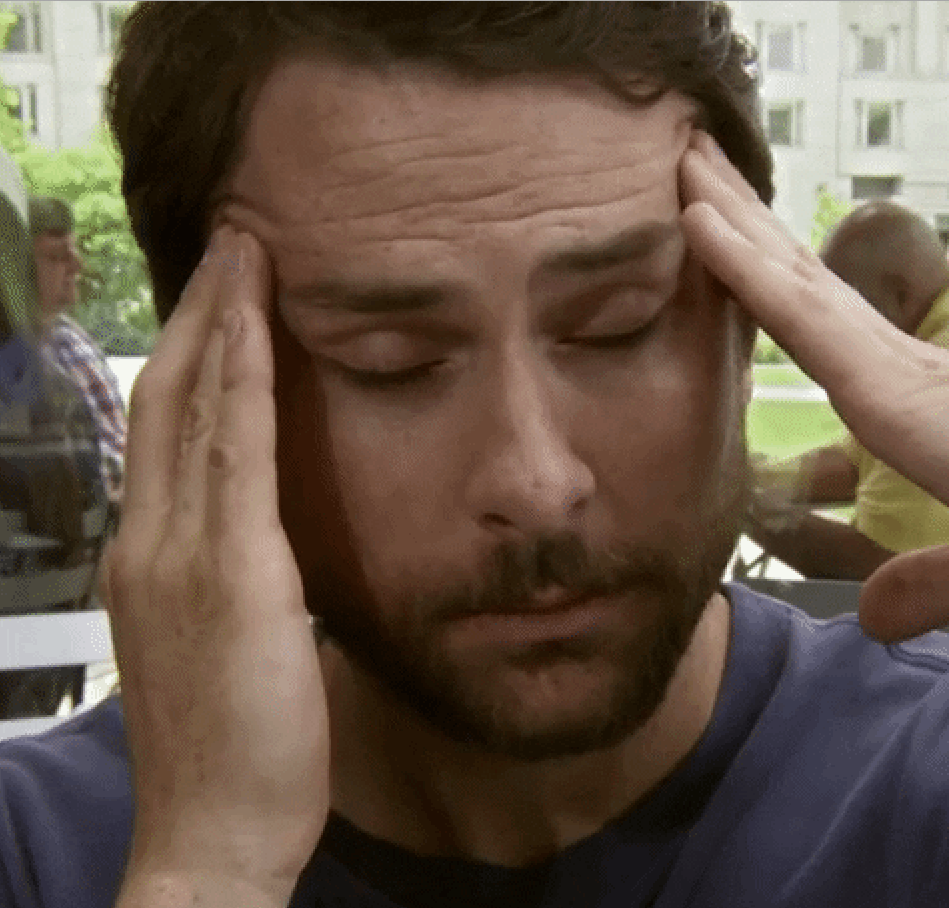 Charlie Day rubbing his head in agony