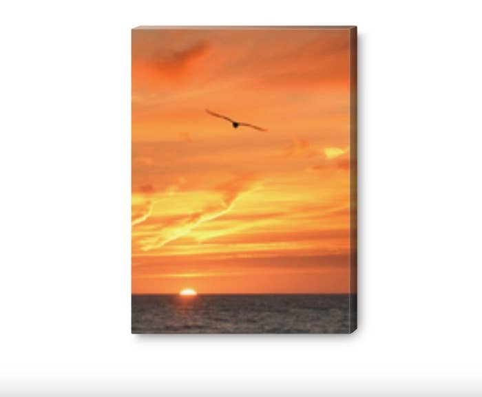 The canvas print of a sunset over an ocean