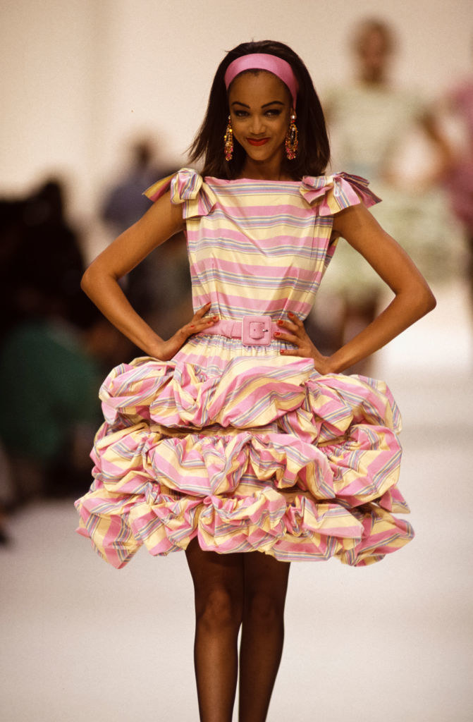 on a runway as a model
