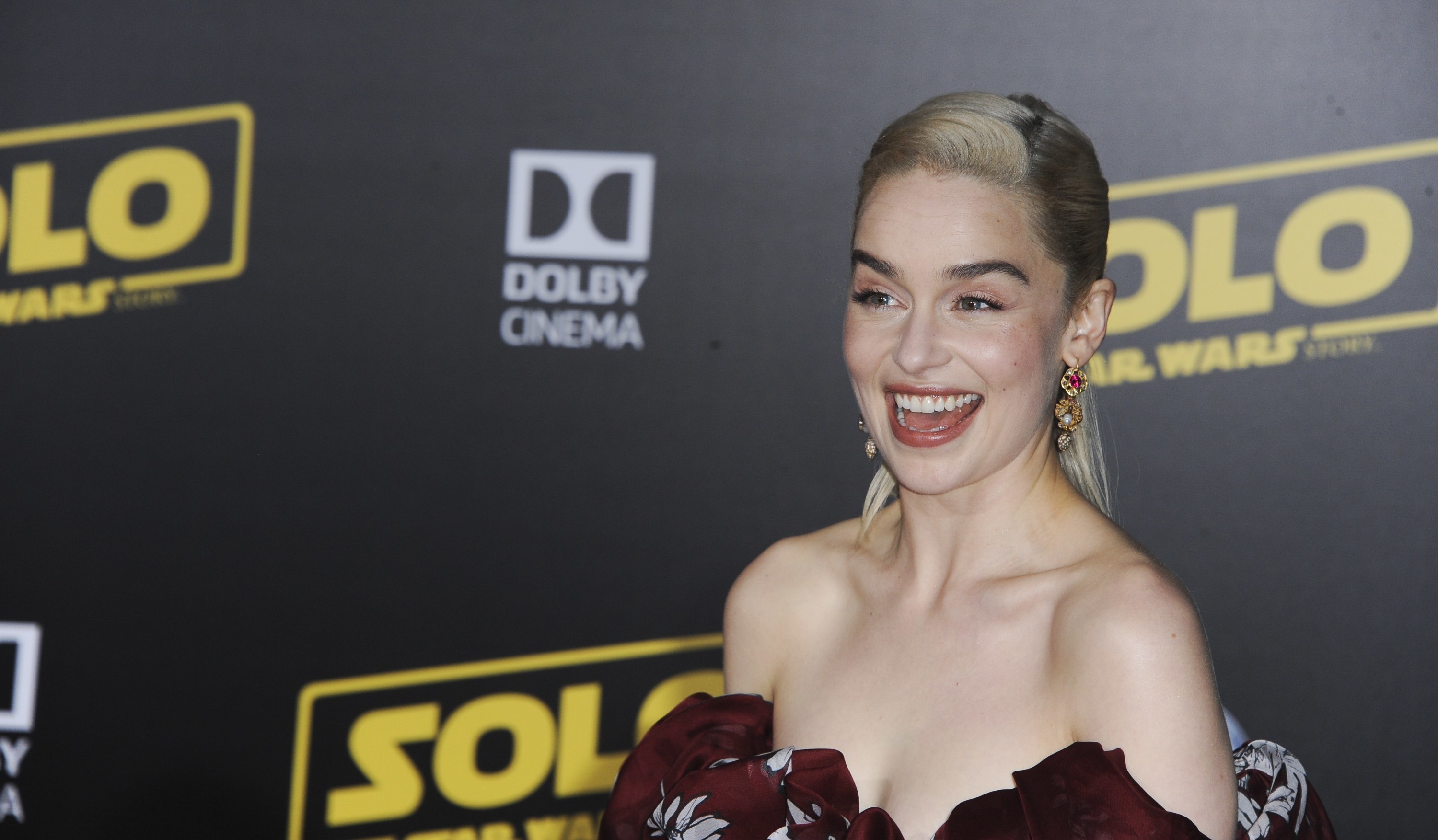 Emilia Clarke smiles wide at arrivals for the &quot;Solo: A Star Wars Story&quot; premiere in Los Angeles