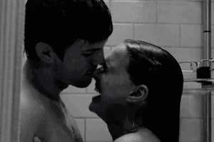A couple kissing in the shower