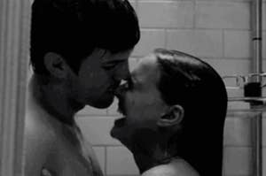A couple kissing in the shower