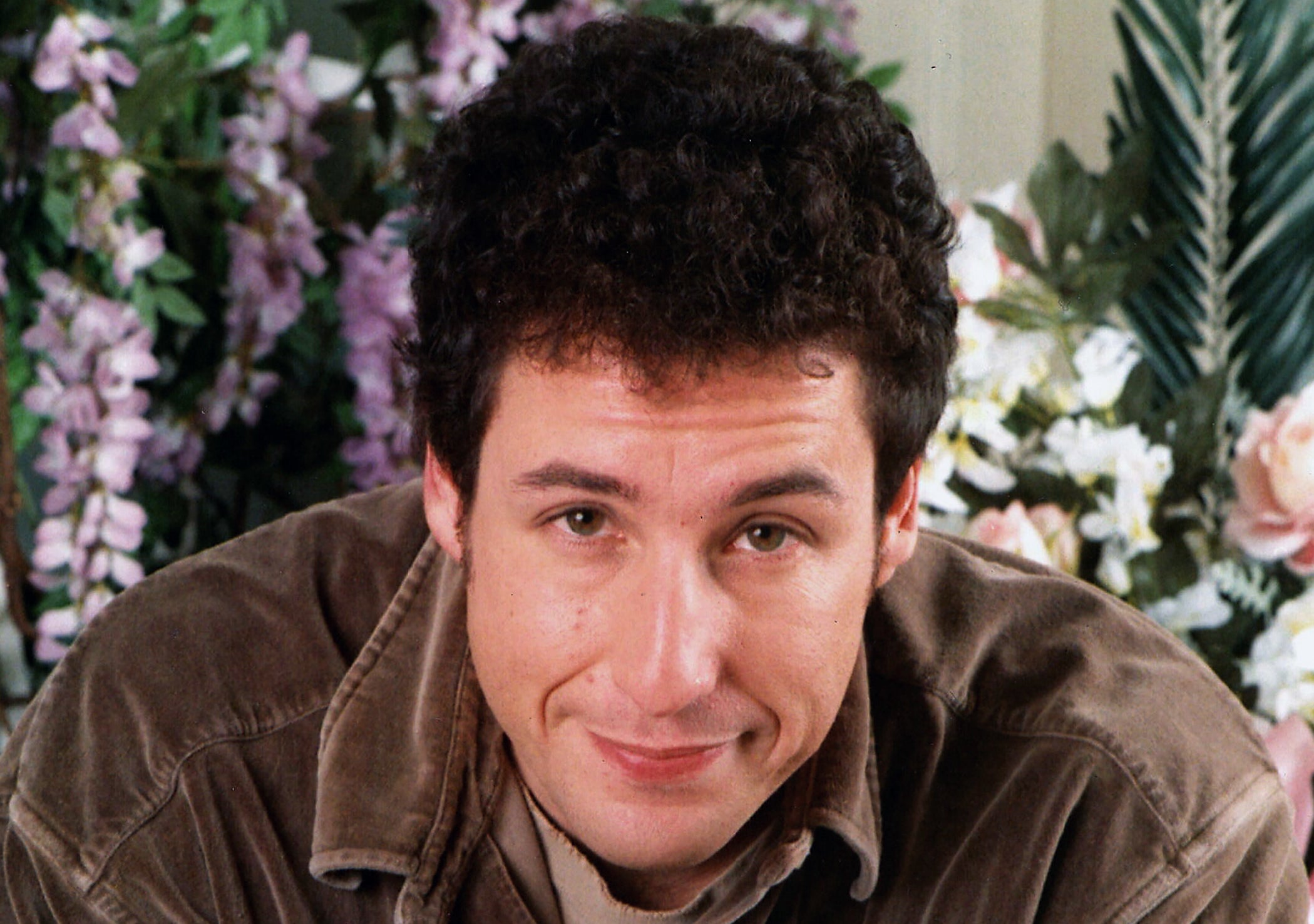 Headshot style photo of Adam Sandler