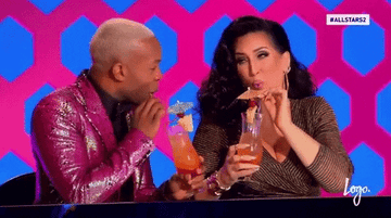 Todrick Hall and Michelle Visage sipping drinks and laughing