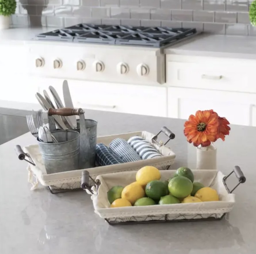 Wire baskets holding various items on kitchen counter