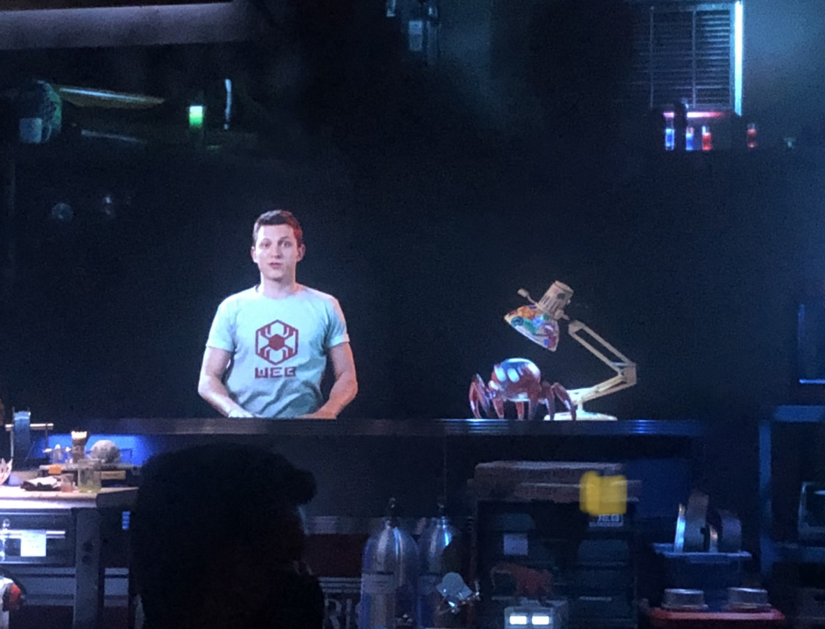 A hologram of Tom Holland and a spider-bot