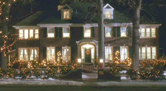 The house from Home Alone, a two story mansion, decorated for Christmas