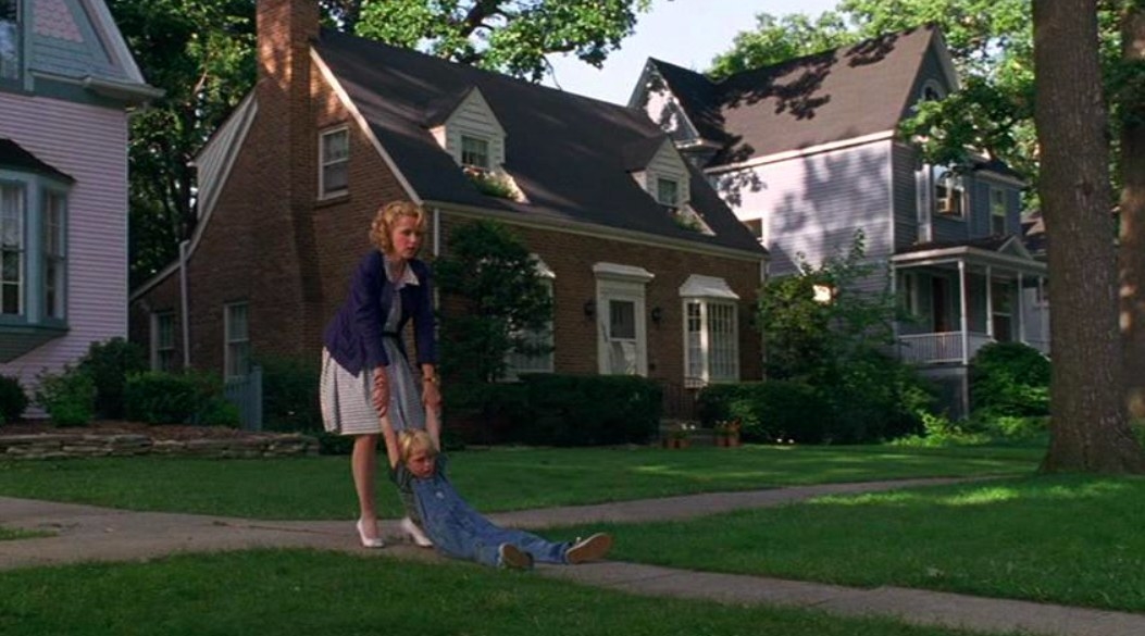 The neighborhood from Dennis the Menace with Dennis and his. mother in the foreground