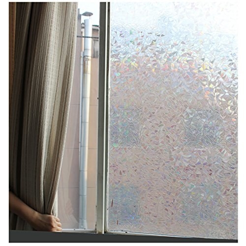 A frosted window film with a person opening the curtains 