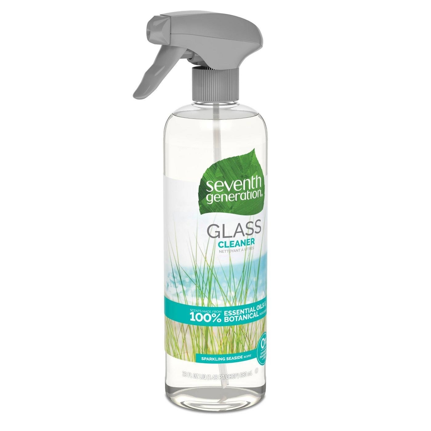 A clear bottle with green grass an blue detail
