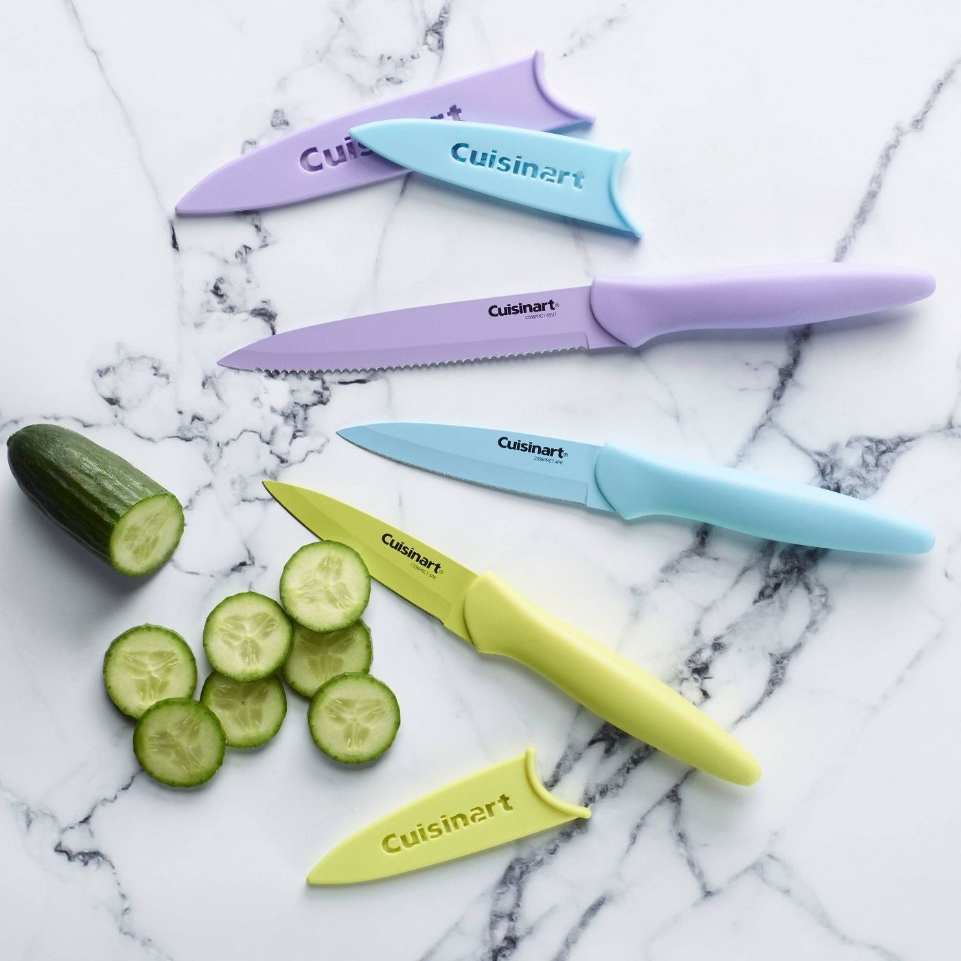 A green, blue and purple knife with a cucumber