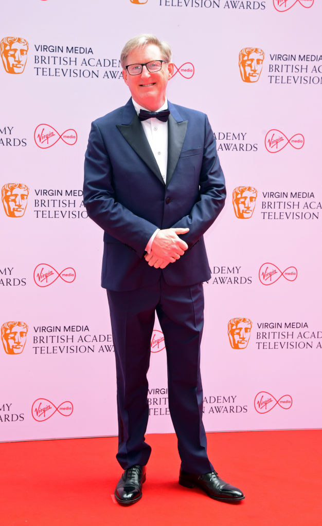 Adrian Dunbar arrives for the Virgin Media BAFTA TV awards in a suit