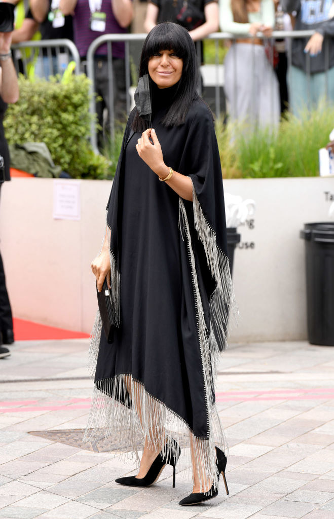 Claudia Winkleman arrives for the Virgin Media Bafta TV Awards in a fringe dress and Louboutin heels