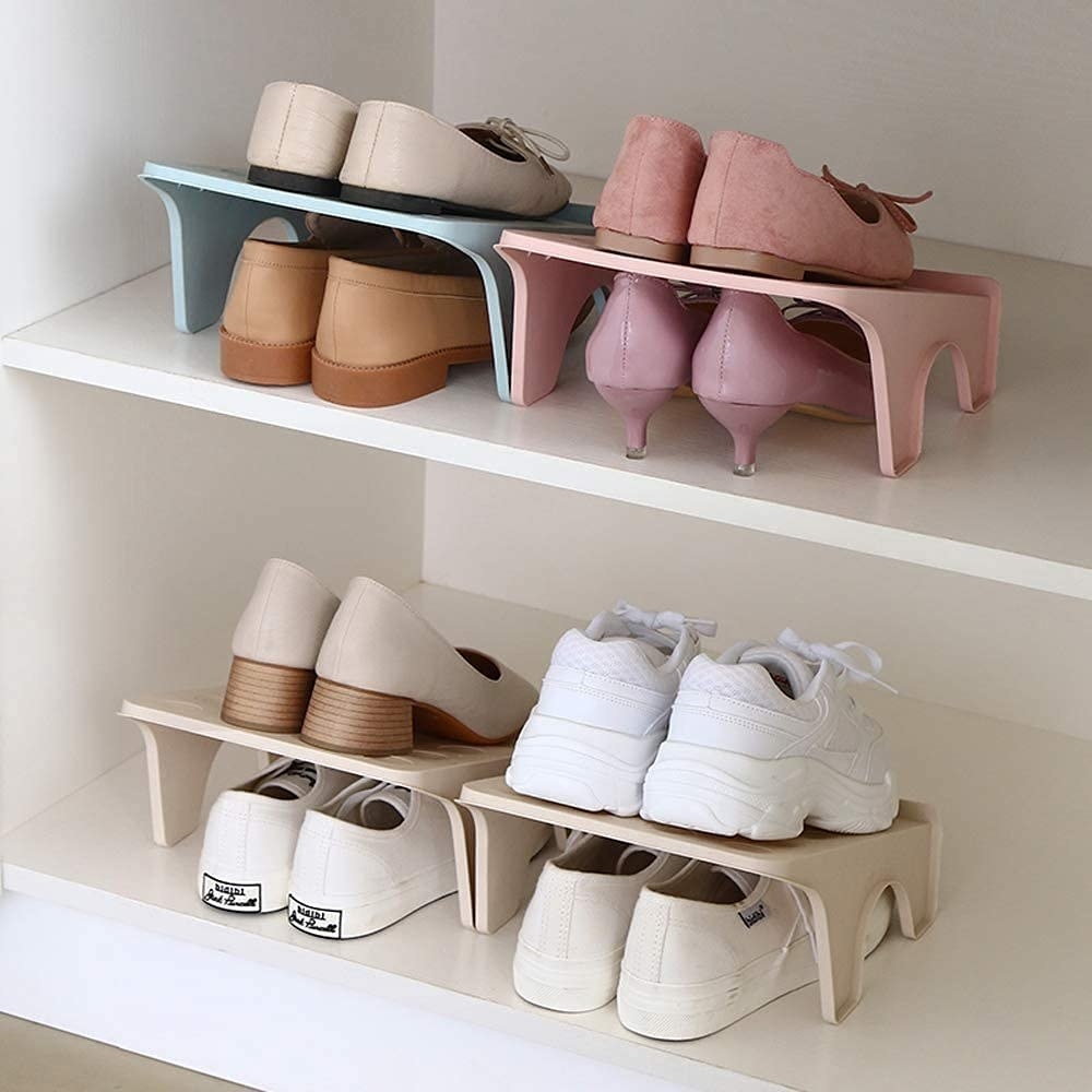 Slanted shoe organisers with different pairs of shoes on the top and the bottom