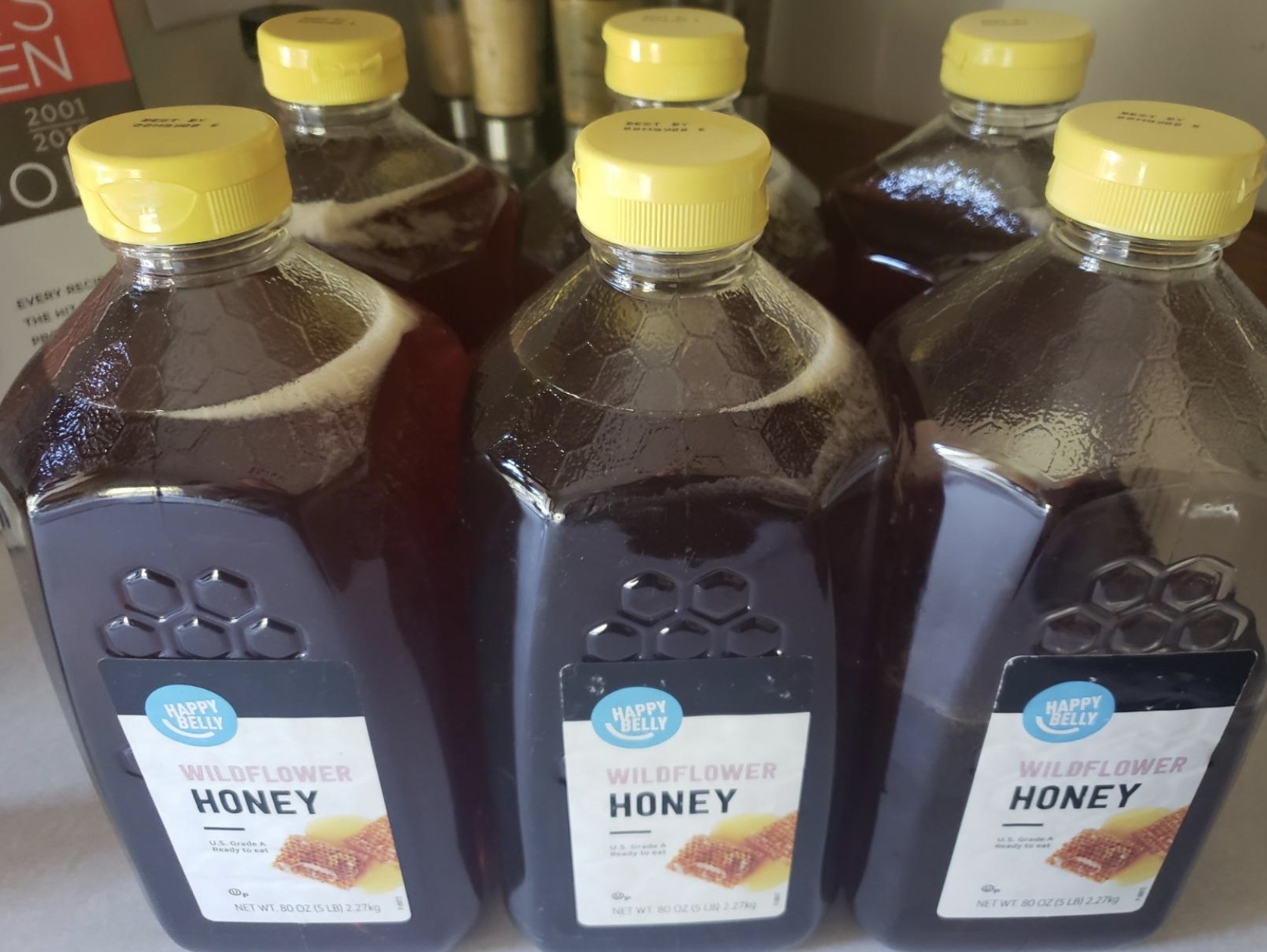 reviewer photo showing six bottles of honey