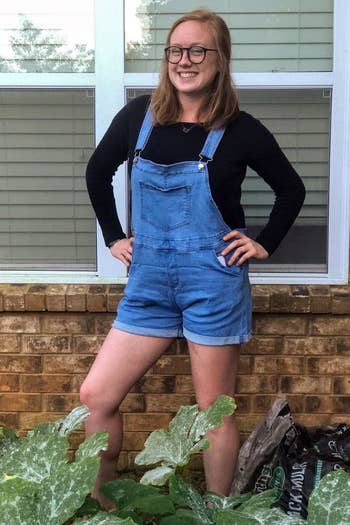 Reviewer wearing overall shorts
