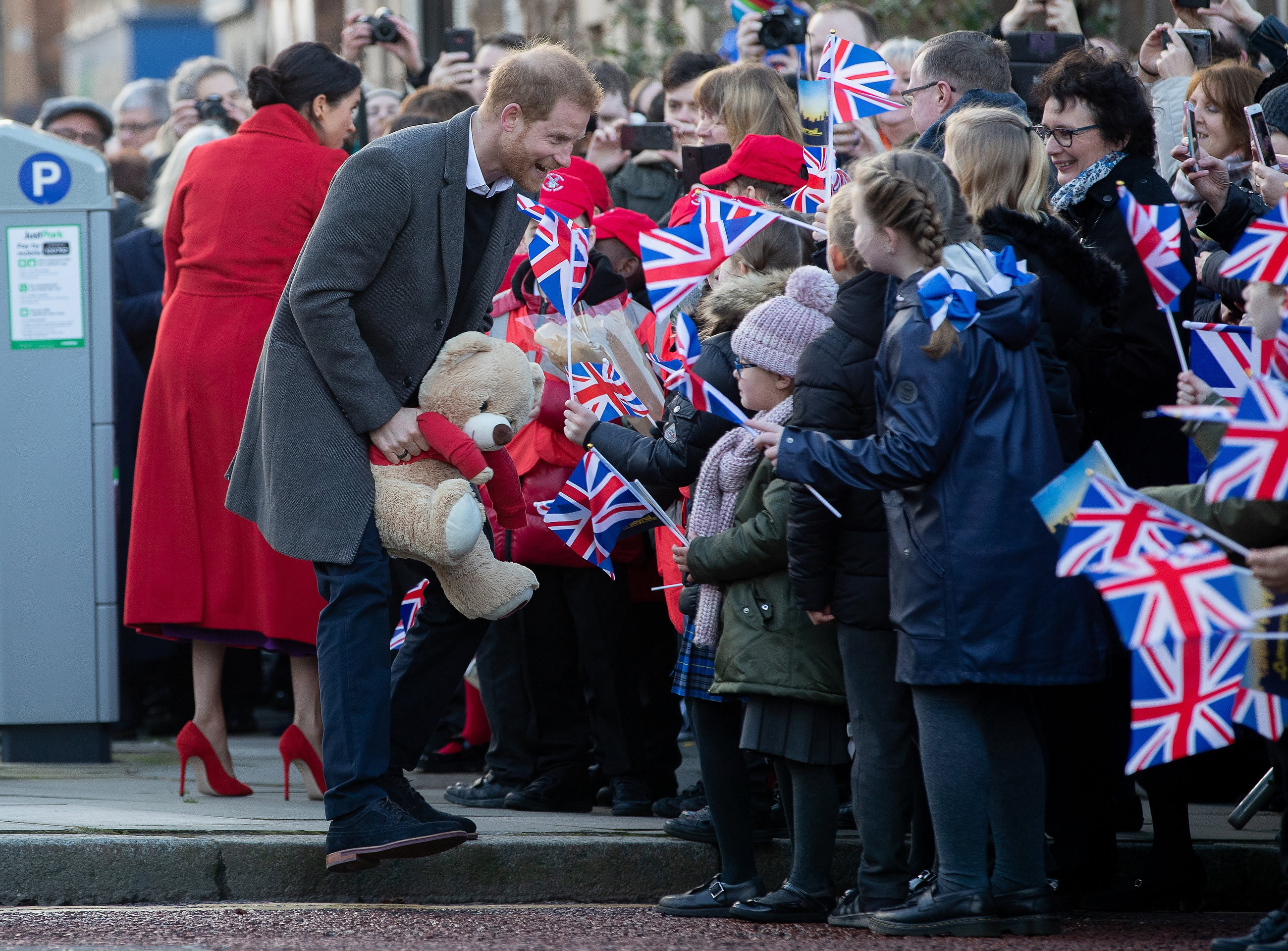 Prince Harry, Duke of Sussex and Meghan, Duchess of Sussex greet well-wishers on Hamilton Square in Birkenhead, United Kingdom in 2019