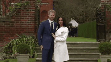 Meghan Markle and Prince Harry wave to the public