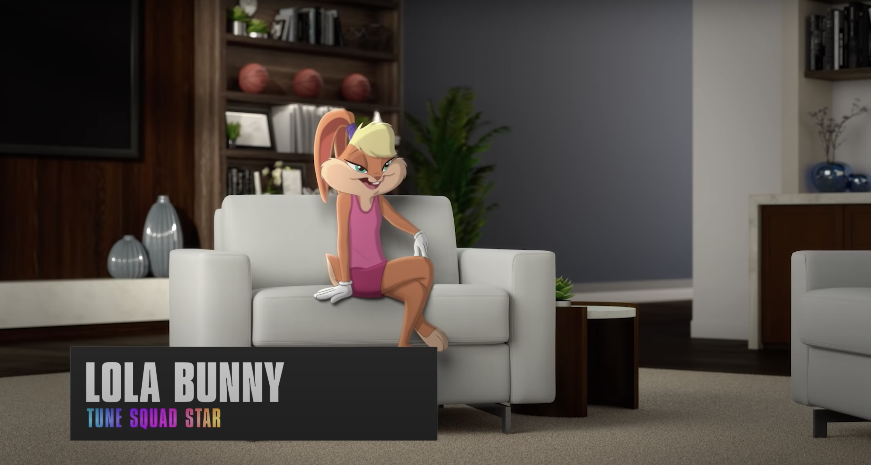 The 2021 version of Lola Bunny conducts an interview while sitting on an armchair, legs crossed